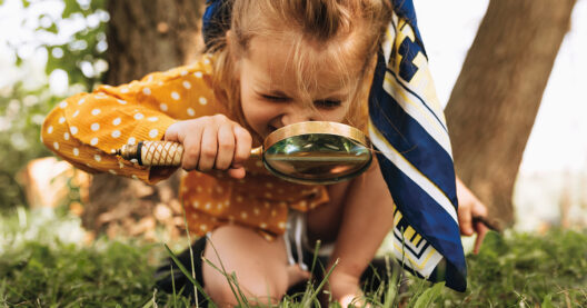 image-of-cute-kid-with-magnifying-glass-exploring-the-nature-out-2